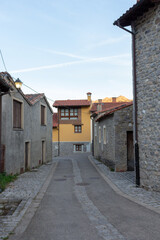 Fototapeta na wymiar Sotres, Spain - September 3, 2020: Views of the streets and houses in Sotres village in the Europa Peaks (Picos de Europa National Park), Cantabrian Mountains, northern Spain.
