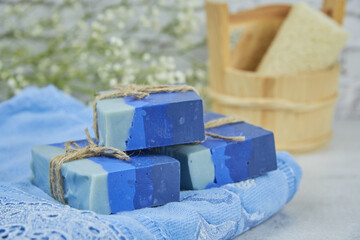 Bright organic aromatic handmade soap on a terry towel.