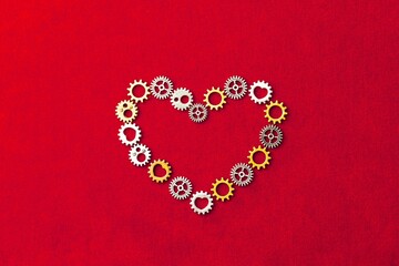 heart shape made of gears, red background