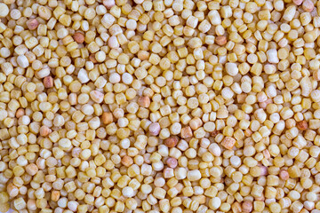 Israeli couscous pile (Ptitim) close up isolated on white background (Turkish name; kuskus)