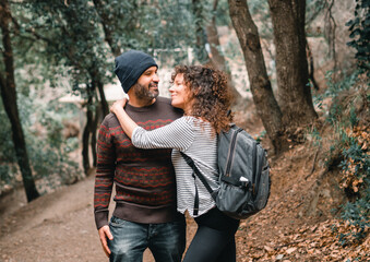 A couple of hikers show affection in nature