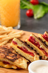 Turkish toast flat baked bread called bazlama with Turkish sausage and cheese on stone table, Bazlama Toast.