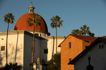 Late afternoon sun shines on the historic Basilica and historic district of San Juan Capistrano, California, USA.