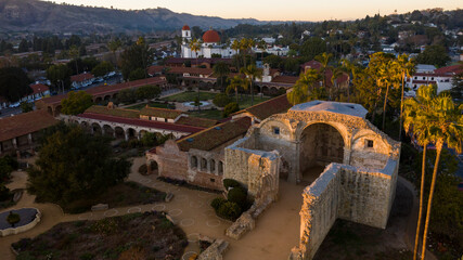 Sunset aerial view of the Spanish Colonial era mission and surrounding city of downtown San Juan...