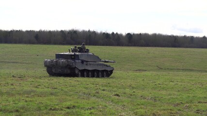 Fototapeta premium Action shot of a British army Challenger 2 FV4034 Main Battle Tank on a military exercise, Salisbury Plain, UK 