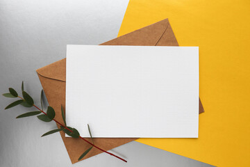 postcard mockup. white envelope on a gray and yellow background. invitation 