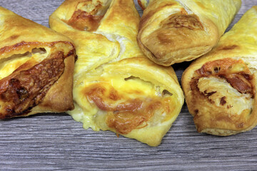 Melted Cheddar Cheese And Bacon Wrapped In Flaky Puff Pastry.