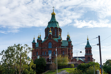 Fototapeta na wymiar The eastern orthodox Uspenski Cathedral of Helsinki at broad daylight