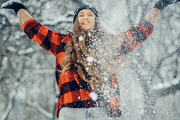Winter young woman portrait. Beauty Joyful Model Girl laughing and having fun in winter park. Beautiful young female outdoors, Enjoying nature, wintertime