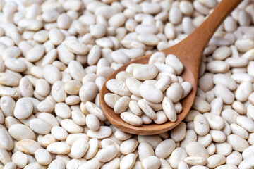Haricot bean in wooden spoon