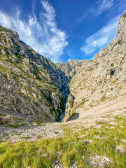 The Cares Route in the heart of Picos de Europa National Park, Cain-Poncebos, Asturias, Spain. Narrow and impressive canyon between cliffs, bridges, caves, footpaths and rocky mountains.