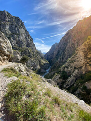 The Cares Route in the heart of Picos de Europa National Park, Cain-Poncebos, Asturias, Spain. Narrow and impressive canyon between cliffs, bridges, caves, footpaths and rocky mountains.