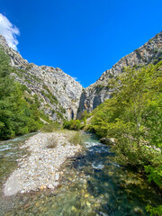 Fototapeta na wymiar The Cares river near Caín village (León), the route of the Cares Canyon, Picos de Europa National Park, between Asturias and Leon provinces, Spain.