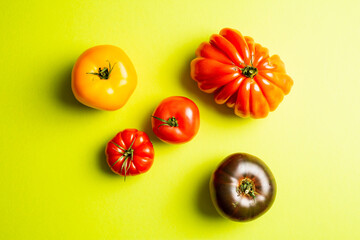 heirloom tomatoes on bright green