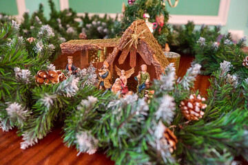 Christmas figurines surrounded by fir branches
