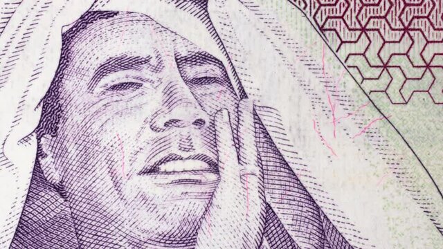 Muammar Gaddafi portrait on Libya 1 dinar (2009) banknote tracking. Slider shot