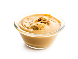 Peanut butter in bowl isolated on white background.
