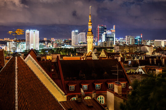 Panorama skyline of Estonian capital Talinn during night - old town in front of modern high-rise district