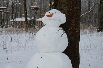 snowman in winter forest