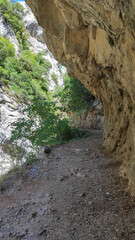 The Cares Route in the heart of Picos de Europa National Park, Cain-Poncebos, Asturias, Spain. Narrow and impressive canyon between cliffs, bridges, caves, footpaths and rocky mountains.