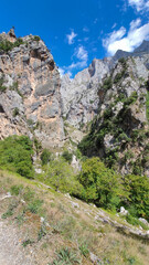 The Cares Route in the heart of Picos de Europa National Park, Cain-Poncebos, Asturias, Spain. Narrow and impressive canyon between cliffs, bridges, caves, footpaths and rocky mountains.