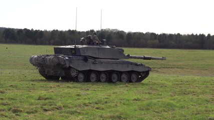Action shot of a British army Challenger 2 FV4034 main battle tank on military exercise, Salisbury Plain UK