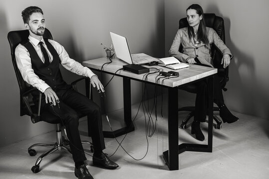 A woman's special agent tests a lie detector and a polygraph test on a young suspect. The questions of the expert accused in the interrogation room record the reactions. The concept of truth and revel