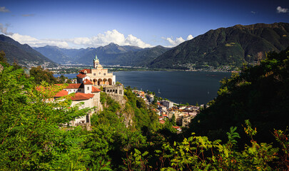 Fototapeta na wymiar Madonna del Sasso in Locarno blue sky beautiful summer green trees colorful hdr tower