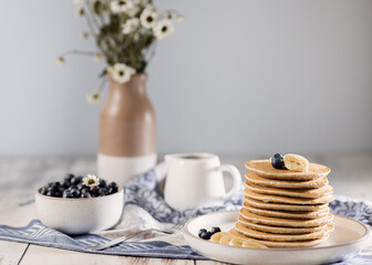 Homemade banana pancakes with blueberry, easy recipes homemade cooking, selective focus