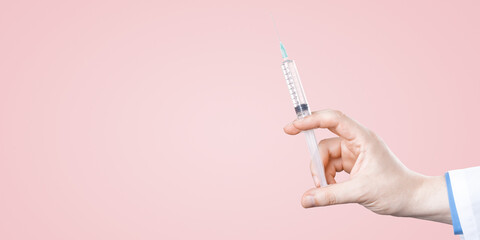 Doctor holding a syringe with vaccine against corona virus.