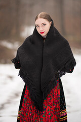 Young beautiful slovak woman in traditional dress. Slovak folklore