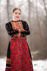Young beautiful slovak woman in traditional dress. Slovak folklore