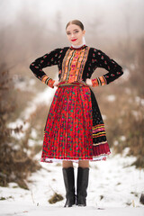 Young beautiful slovak woman in traditional dress. Slovak folklore
