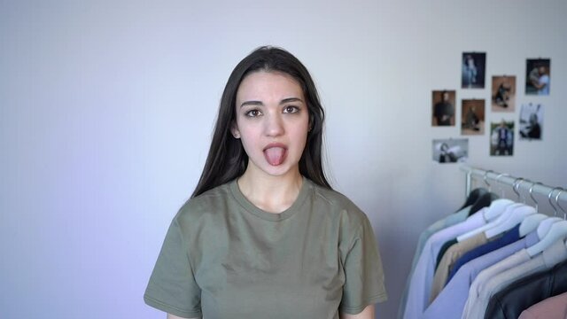 Charming Brunette Woman  Looking At the Camera showing tongue