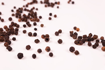 side view at an angle of brown and black balls scattered chaotically