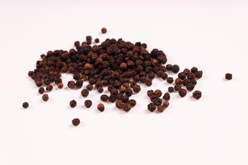 side view of black and brown balls piled in a pile