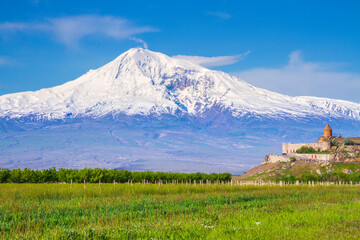 Awe-Inspiring medieval Khor Virap monastery in front of Mount Ararat viewed from Yerevan, Armenia. This snow-capped dormant compound volcano described in the Bible as the resting place of Noah's Ark.