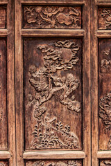 Closeup of a Traditional Carving on a Wooden Screen Door at the Thien Tru Pagoda Temple, also known as the Heaven Kitchen, at the Perfume Pagoda outside of Hanoi, Vietnam