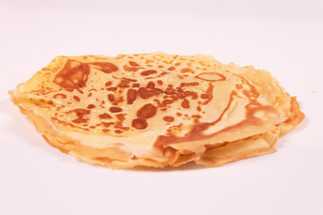 distant view of several delicious yellow pancakes stacked on top of each other