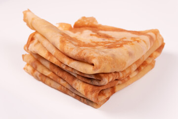 a stack of pancakes folded in a triangle