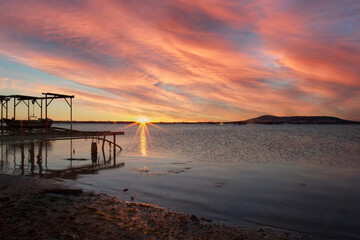 Fototapeta premium Sunrise on the Thau Lagoon with Sete