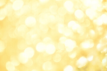 Gold defocused glitter.  Bokeh light of gold glitters background. 