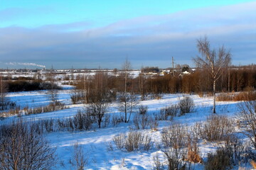 Fototapeta na wymiar A small village in a beautiful location. Winter sunny morning
