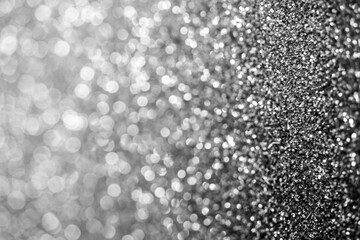 Silver defocused glitter.  Bokeh light of gold glitters background. 