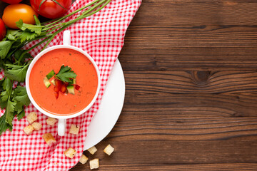 Wonderful tomato gazpacho soup with herbs and tomatoes. Top view. Copy space.