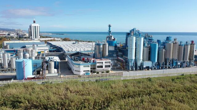 Aerial view of industrial facilities of Mataro factory producing detergent and air fresheners, Costa del Maresme, Spain