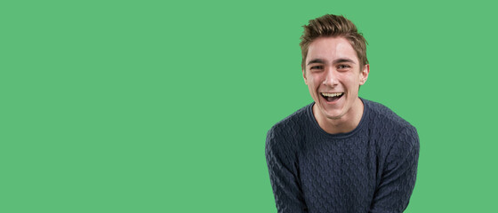 Overjoyed feels the euphoria of an online win, excited happy young guy, the concept of luck on a...