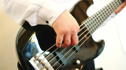 Guitarist playing of guitar. Close up shot.