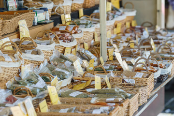 Different spices in boxes at market stall