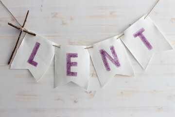 Lent word banner on white wood background